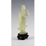 A Chinese carved jade figure of Lan Caihe, 20th century, the figure set to a carved and pierced