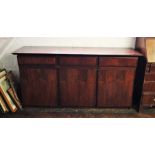 A mid 20th century Danish design rosewood sideboard by Dyrlund, the rectangular top above three