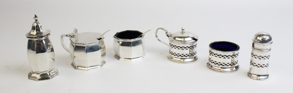 A George V silver condiment set comprising wet mustard, pepperette and salt by Stokes & Ireland,