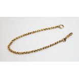 A yellow metal fancy link bracelet chain, with attached loop and lobster claw fastening, claw