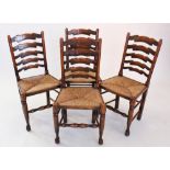 A set of 18th century style oak ladder back kitchen chairs, late 20th century, each with five