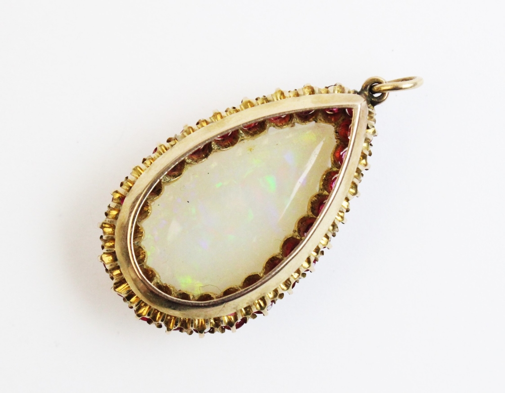 An opal and untested ruby set pendant within a fitted Wartski case, the pear shaped opal - Image 4 of 5