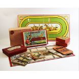 A collection of vintage games and booklets, to include 'The Favorite' boxed mechanical race game,