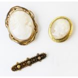 A Victorian Etruscan revival style bar brooch, the torpedo shaped brooch with applied rope twist and