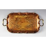 A late 19th/early 20th century German Art Nouveau copper tray by Carl Deffner, of rectangular form