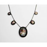 A micro-mosaic necklace, comprising five graduating oval panels measuring between 13mm x 10mm and