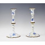 A pair of late 18th/early 19th century Georgian Bilston enamelled copper candlesticks, each of