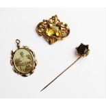 An early 20th century citrine and diamond set stick pin, comprising a central round mixed cut