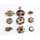 A collection of Scottish and Scottish type hardstone set brooches, to include an an oval example