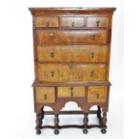 A 17th century and later walnut chest on stand, the pine carcass with three small drawers above