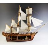 A wooden scratch built model of a masted vessel, 20th century, the three masts complete with rigging