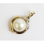 A diamond and cultured pearl 9ct gold pendant, the central round mabe pearl measuring 15mm diameter,