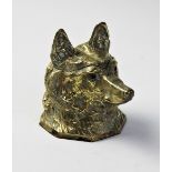 A Victorian novelty inkwell modelled as a foxes mask, with hinged cover and set with glass eyes,