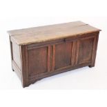 An 18th century and later oak coffer, the rectangular moulded two plank hinged cover enclosing a