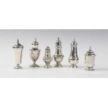 A silver pepperette by Walker & Hall, Sheffield 1913, of urn form on pedestal foot with half-