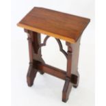 A Victorian pitch pine lectern, the rectangular sloping book rest raised upon 'V' cut trestle type