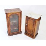 A Victorian figured walnut pot cupboard, the white marble slab top above a single panelled door