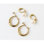 A pair of pearl set 9ct gold clip-on earrings, each comprising a round cultured pearl measuring