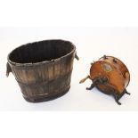 A coopered oak log barrel, 19th century, the oval barrel with handles formed from branch ends, bound