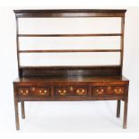 A George III oak Welsh dresser, the associated open plate rack with three shelves upon the base with