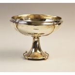 An Art Nouveau silver bonbon dish by Walker & Hall, Sheffield 1915, of circular form on tapered