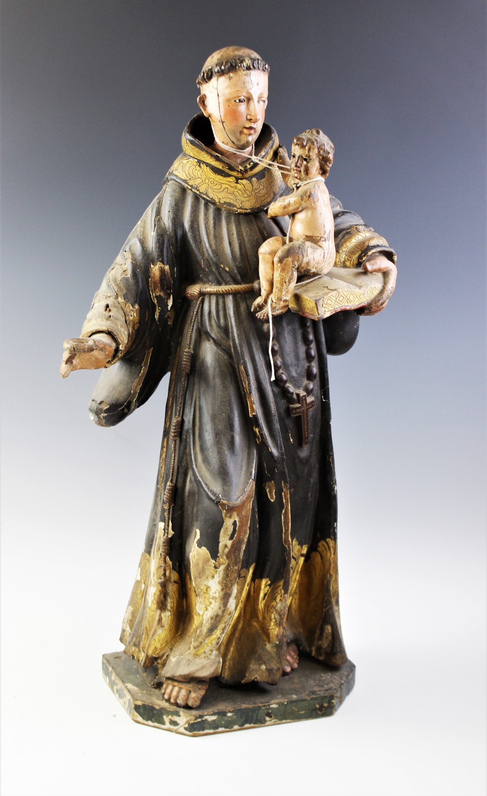 An Italian carved painted wood and gesso figural carving of St. Anthony of Padua and Infant