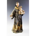 An Italian carved painted wood and gesso figural carving of St. Anthony of Padua and Infant