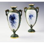 Two Royal Worcester vases, late 19th century, each vase of amphora form with applied stepped handles