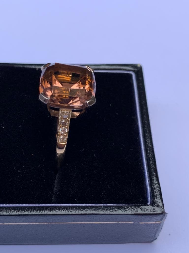 A tourmaline and diamond ring, comprising a central pinkish-orange square cushion cut tourmaline - Image 6 of 8