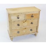 A Victorian pine chest of drawers, with an arrangement of two short and two long drawers, applied