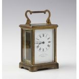 An early 20th century French brass cased carriage timepiece, retailed by Shepheard & Co, 104