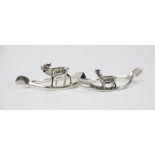 A pair of George V silver figural wishbone napkin rings, C & C Hodgetts, Birmingham 1912, one