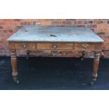 A mid 19th century mahogany writing table, with a leather inset rectangular top above three frieze