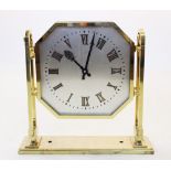 A mid 20th century lacquered brass Art Deco double sided electric ceiling clock, the octagonal