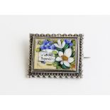 A Victorian enamel plaque brooch, the rectangular brooch enamelled with forget-me-nots and flowers