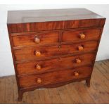 An early 19th century straight front mahogany chest of drawers, the rectangular top inlaid with