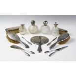 A silver mounted dressing table set by Birks, comprising eleven pieces including a hand-held mirror,