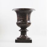 A Swedish porphyry vase, early-mid 19th century, the vase of campana form with a polished exterior