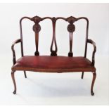 An early 20th century Chippendale revival twin seat mahogany chair,