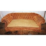 A Victorian Chesterfield type settee, later re-covered with golden brown fabric and rope edging, the