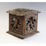 A 19th century carved Black Forest box/lantern, of square form with each panel pierced depicting a