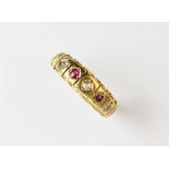 A Victorian 18ct gold diamond and ruby five stone ring, comprising three single cut diamonds