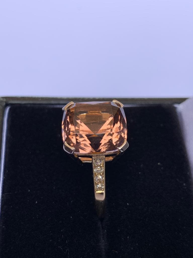 A tourmaline and diamond ring, comprising a central pinkish-orange square cushion cut tourmaline - Image 7 of 8