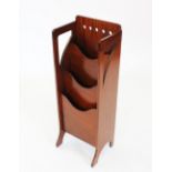 An early 20th century Glasgow school Arts and Crafts vertical mahogany magazine rack, with a row