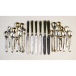 Nine Edwardian silver teaspoons by Walker & Hall, Sheffield 1909 of plain polished form with