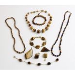 A selection of vintage and modern jewellery set with semi-precious gemstones, including malachite,