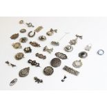 A selection of Victorian and later silver and white metal brooches and pendants, to include an