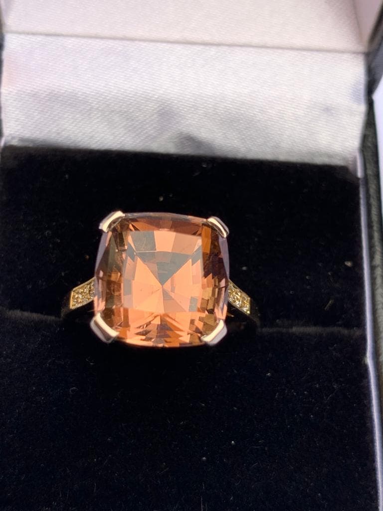 A tourmaline and diamond ring, comprising a central pinkish-orange square cushion cut tourmaline - Image 5 of 8