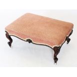 A mid 19th century walnut and upholstered foot stool, the rectangular upholstered seat raised upon