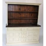 A contemporary painted pine kitchen dresser, the high back with a moulded over hanging cornice above
